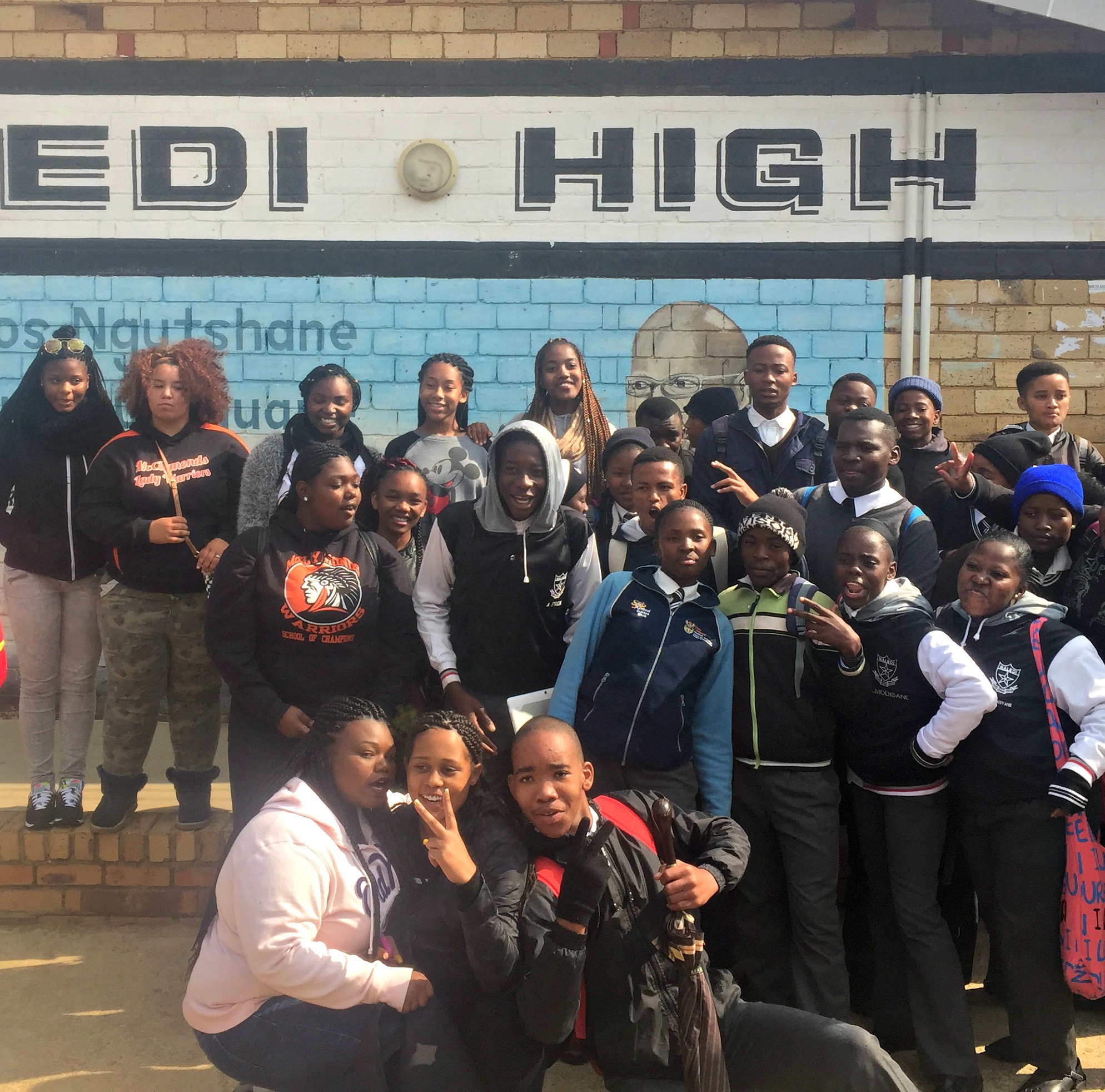 Girls at Naledi HS, with LeAhana Smith, Nakaya Forte and a South African student in the foreground.Photo by Imani Lott.