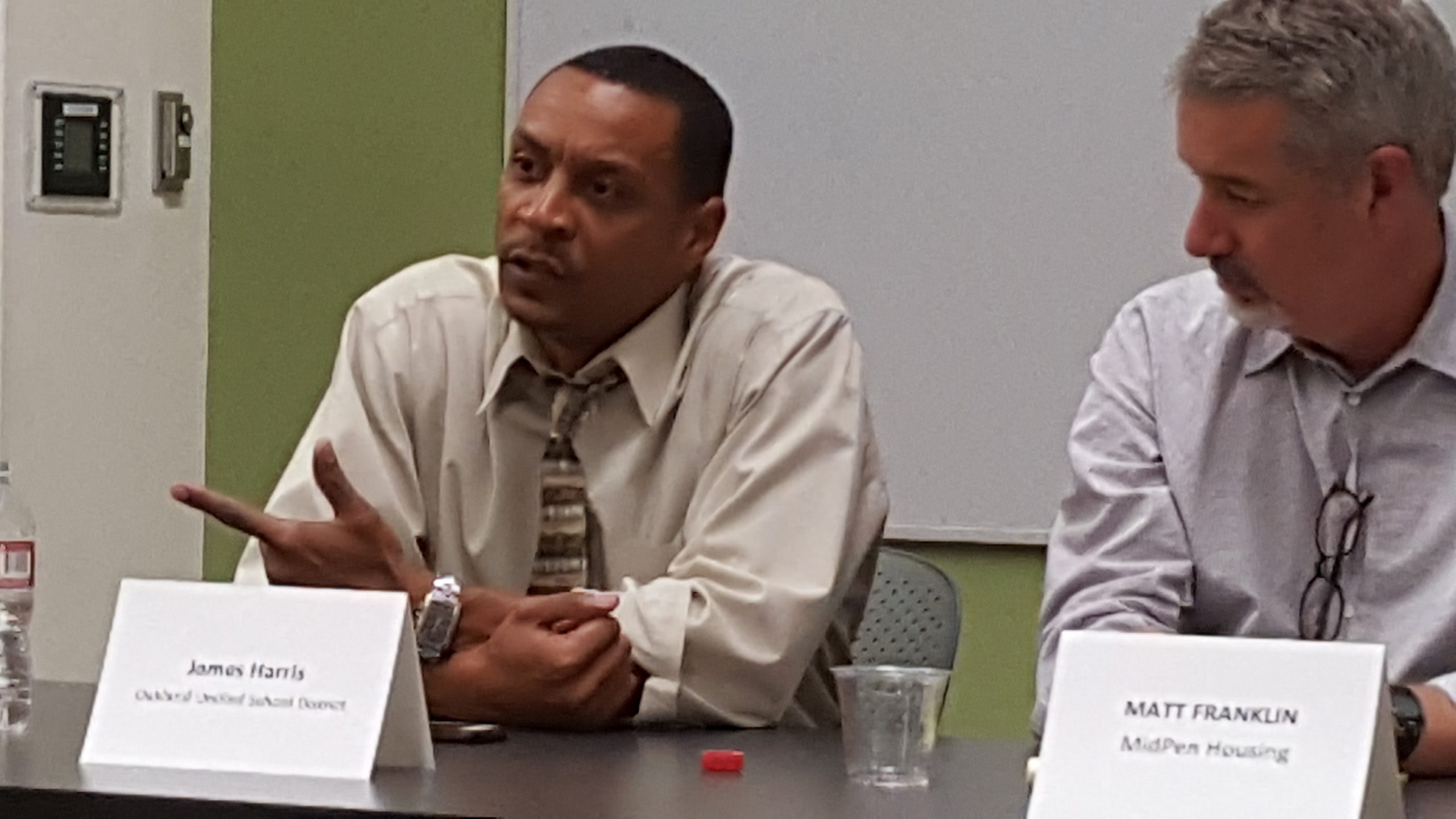 James Harris, president of the Oakland School Board, left and Matt Franklin, president of MidPen Housing
