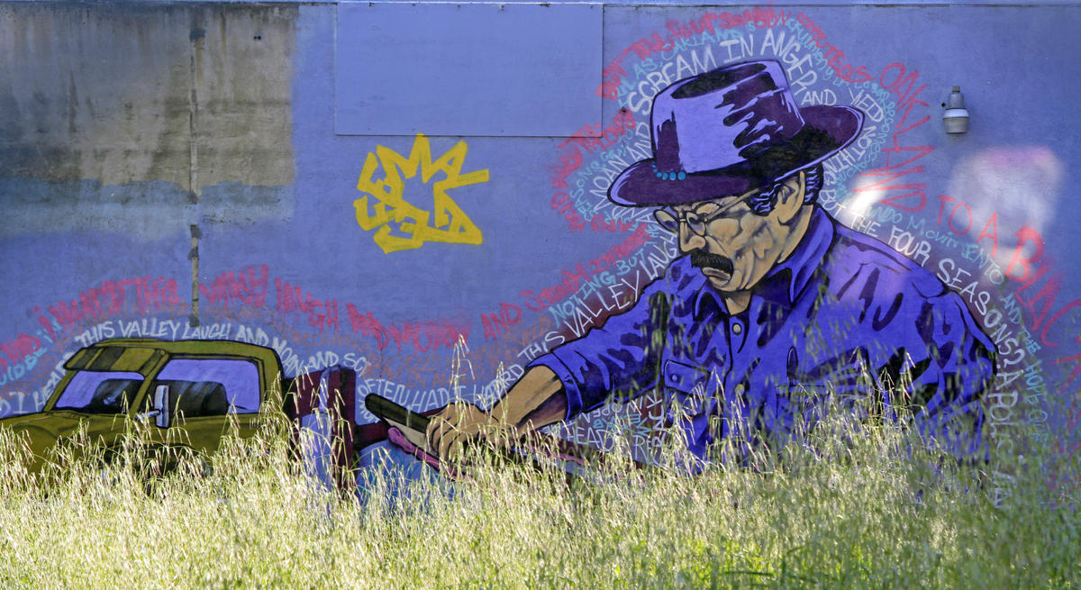 Cultural and political murals cover the walls of the Eastside Arts Alliance on International Boulevard on Wednesday, March 16, 2016 in Oakland, Calif. Students and professional artists team up to create the murals.(Laura A. Oda/Bay Area News Group)