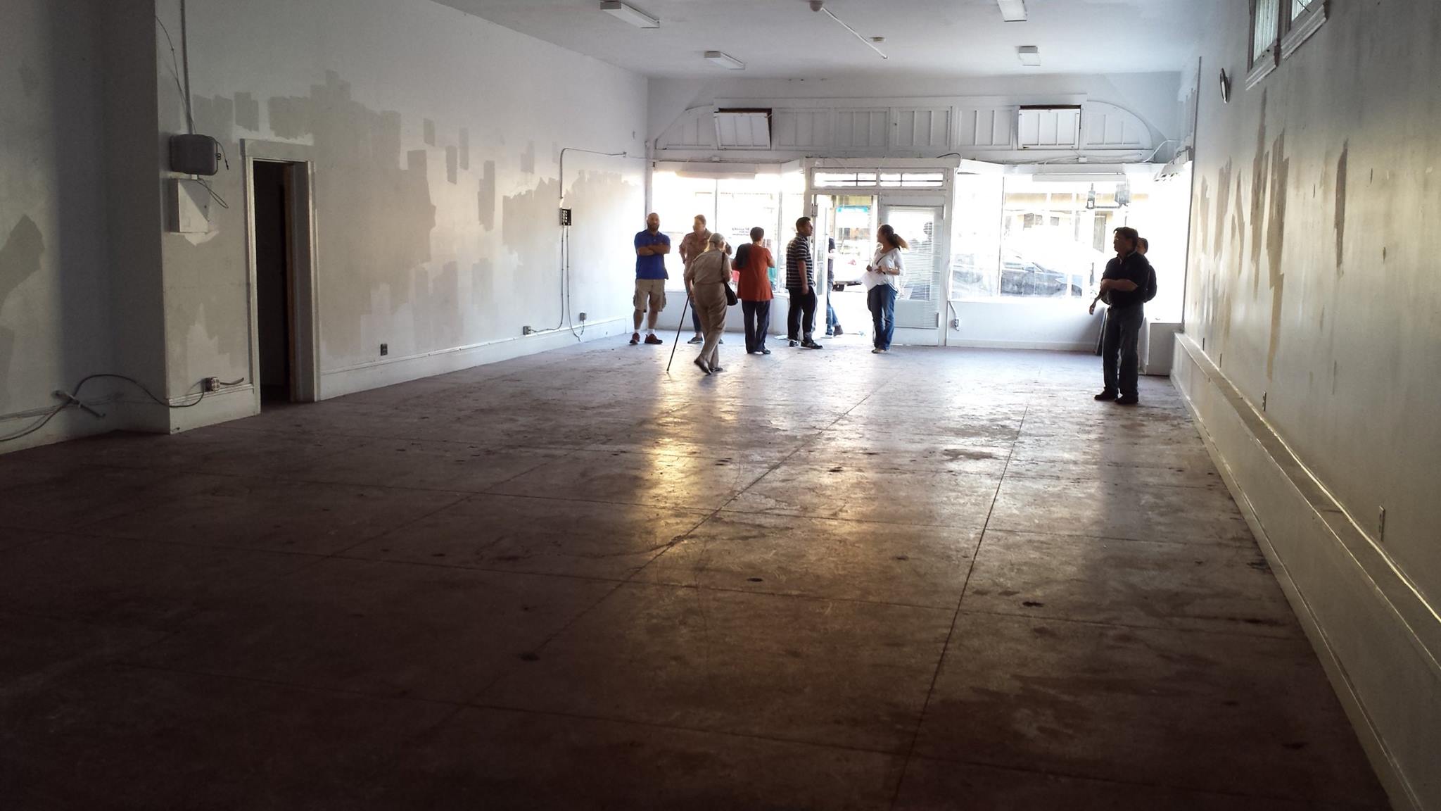 Community members tour the inside of 2701 Fruitvale Avenue in June 2015. Photo Credit: Andrew Park