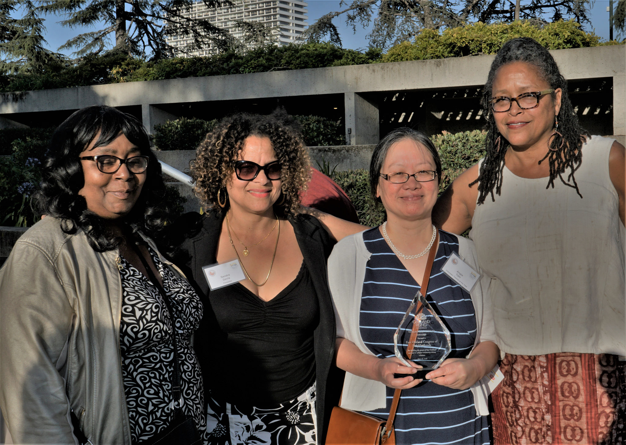 photo showing 2 volunteers from the Congress of Neighborhoods, and 2 award presenters