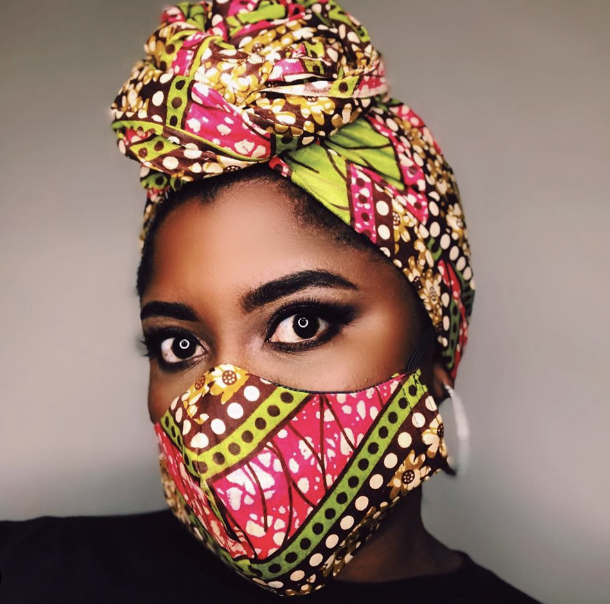 Photo: woman wearing face mask and headwrap made from the same patterned fabric