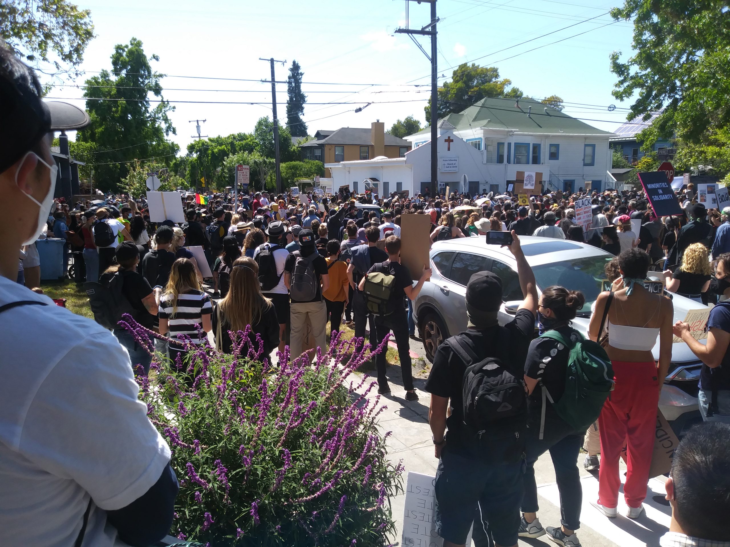 A large crowd with most people wearing masks gather in Berkeley for a Black Lives Matter protest.