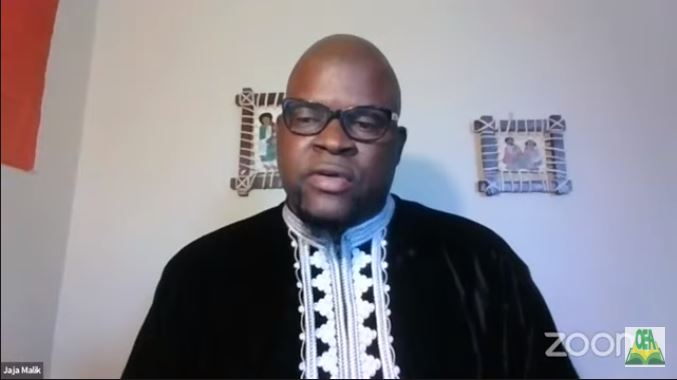 An image of an African American man wearing glasses on a Zoom call.