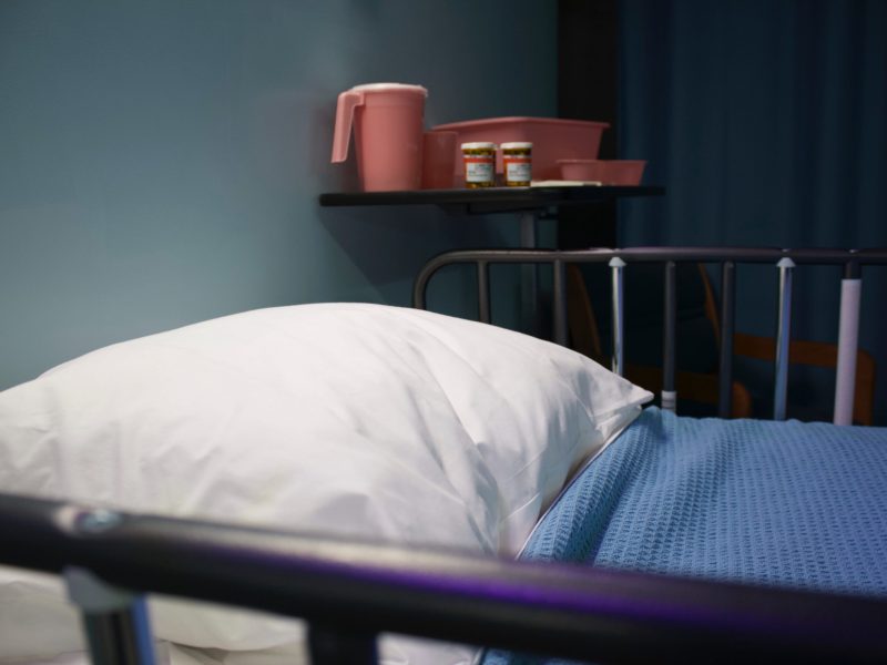 An empty hospital bed.