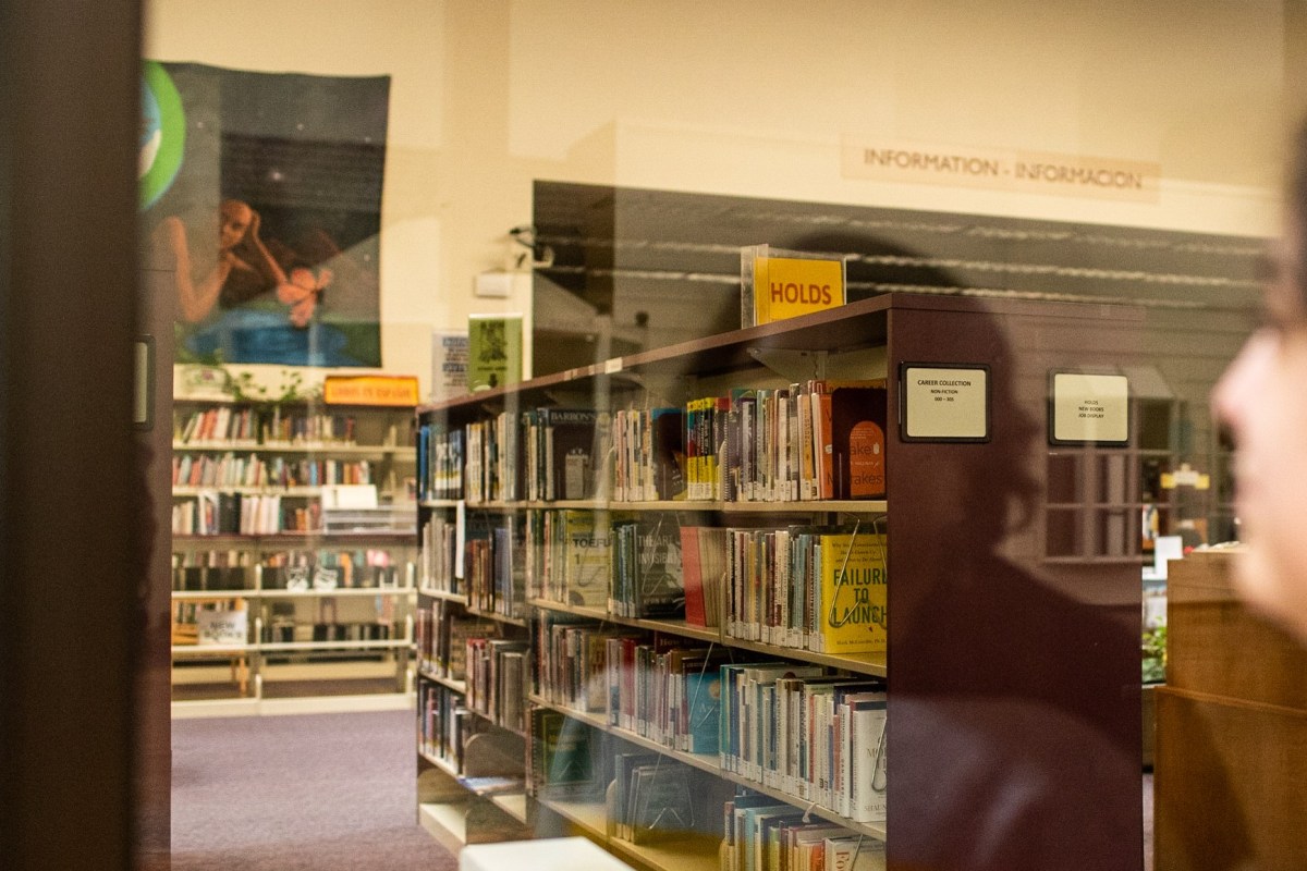 An image of a library full of books.
