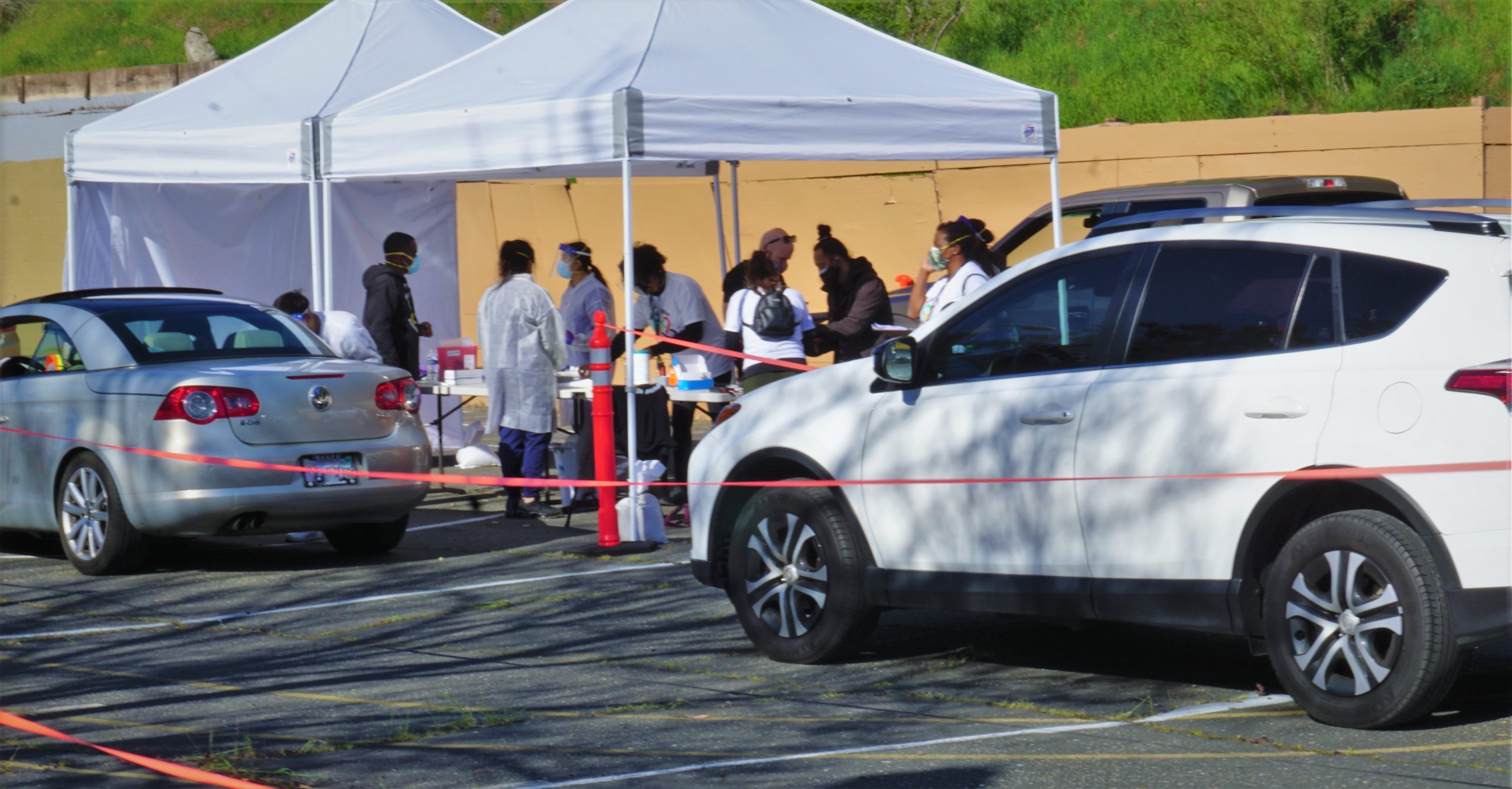 Cars line up to get COVID vaccine in parking lot