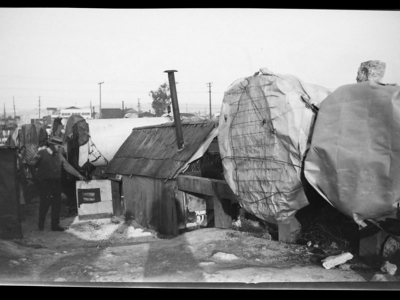 black and white image of tents set up in the early 1930s in Oakland, dubbed "Pipe City"
