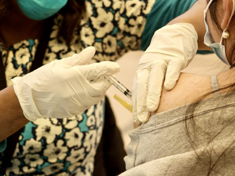 a close up of a syringe going into an arm