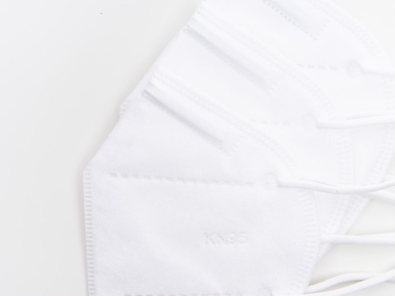 white, sterile kN95 masks against white table