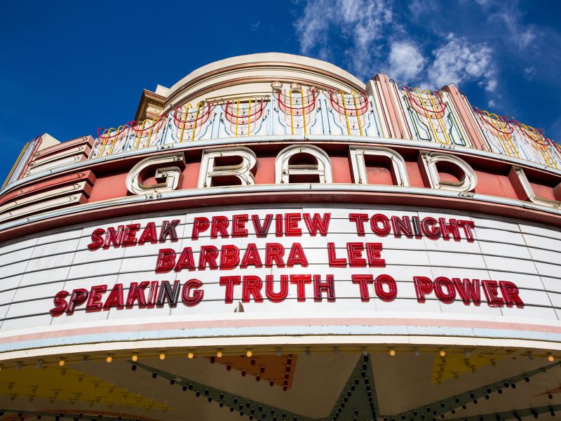 the Grand Lake Theatre marquee says "Sneak Preview Tonight Barbara Lee Speaking Truth to Power"