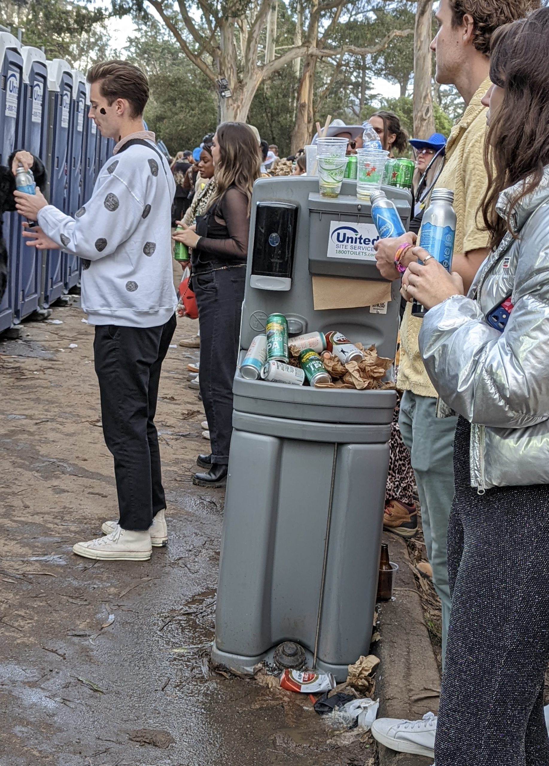 portable hand washing stations were filled with trash.