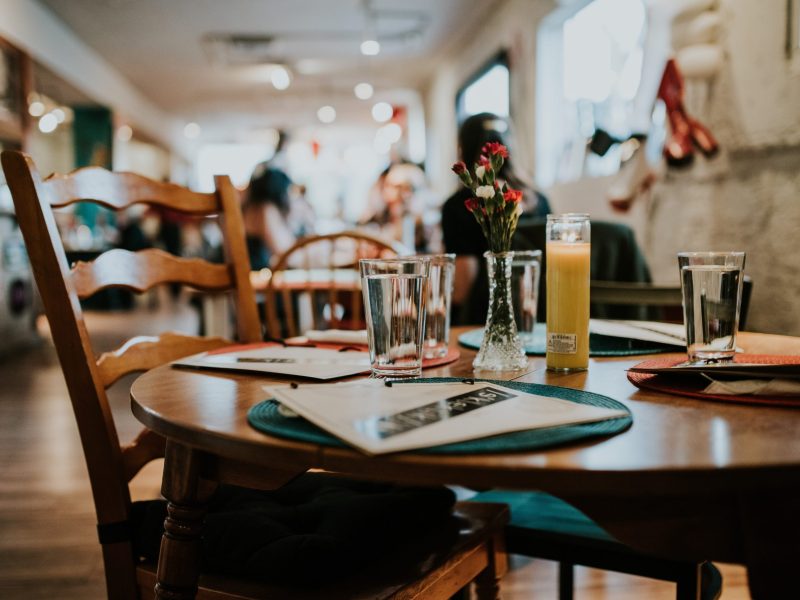 closeup of an indoor wooden table at a restaurant
