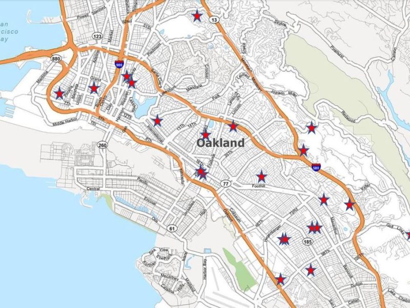 a map with red stars on different schools in Oakland.
