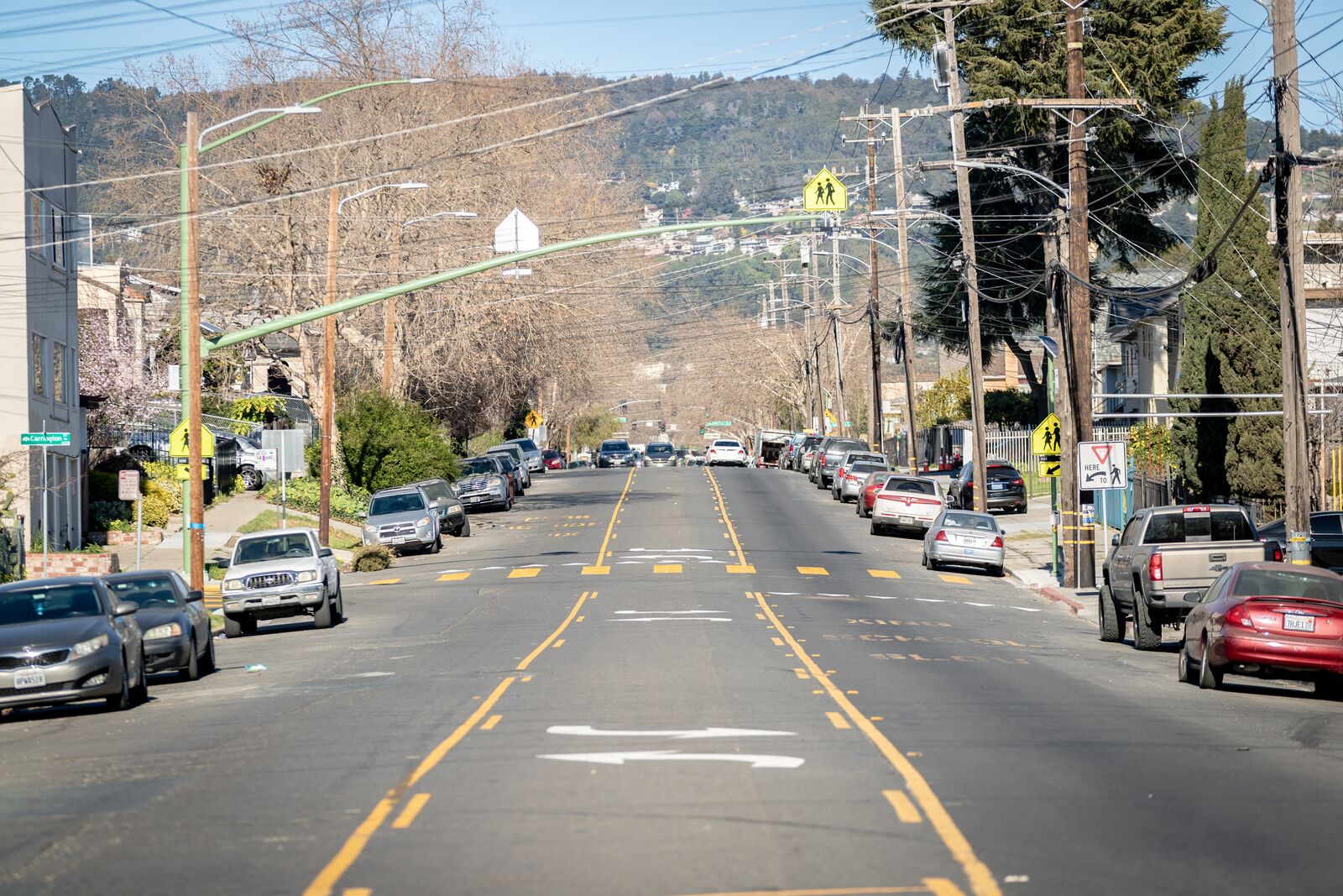 A view fro, a wide street that ends into hills