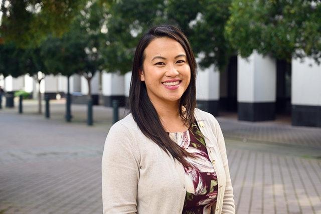 Image of Southeast Asian woman with straight hair smiling for camera