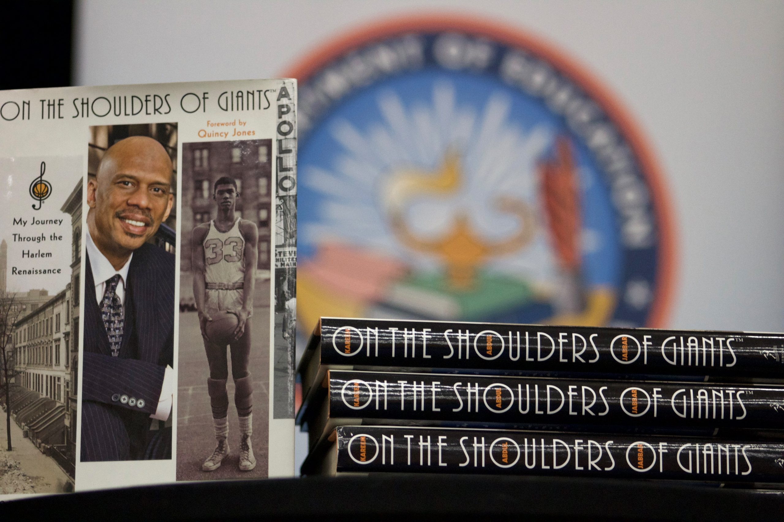 Close up of a cover and spines of the book "On the Shoulder of Giants."