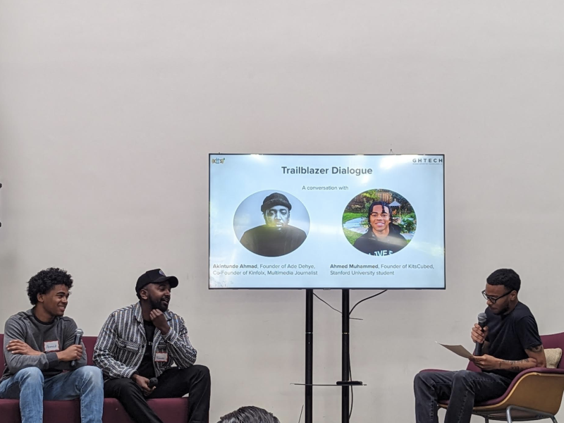 image of three young Black men on a panel speaking about technology