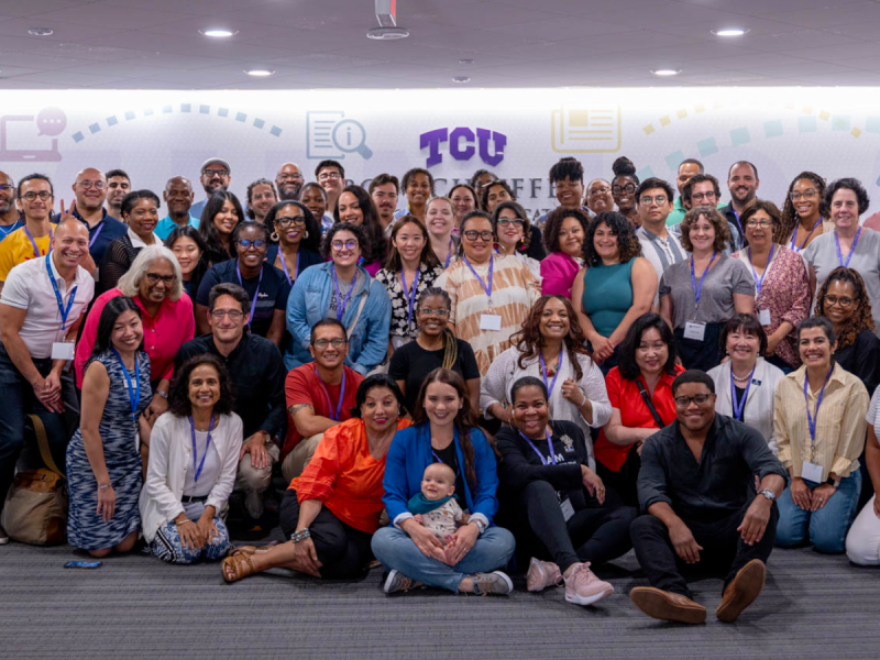 a group of diverse journalists pose for photo