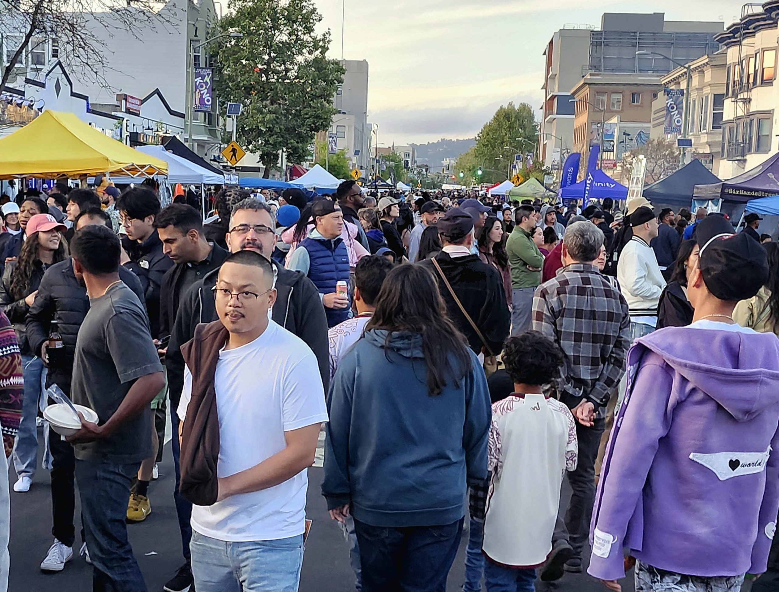 A large diverse crowd at an outdoor event
