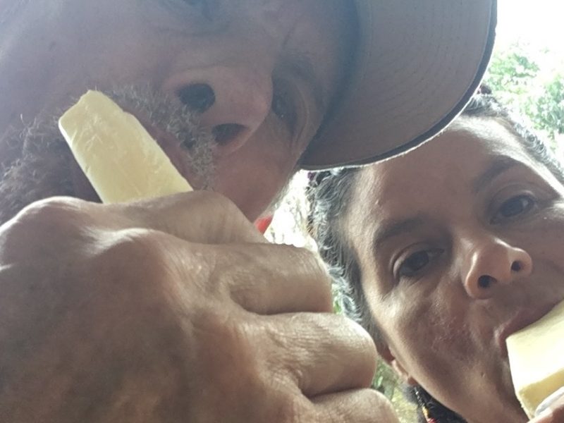 a dad and daughter take a selfie while eating paletas