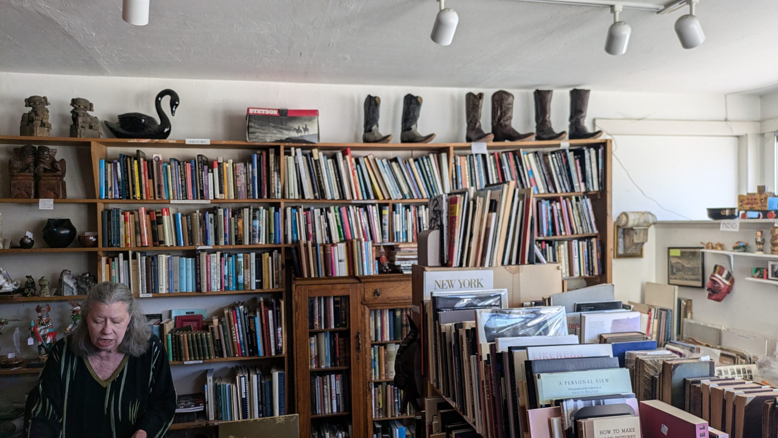 inside a bookstore with high bookshelves